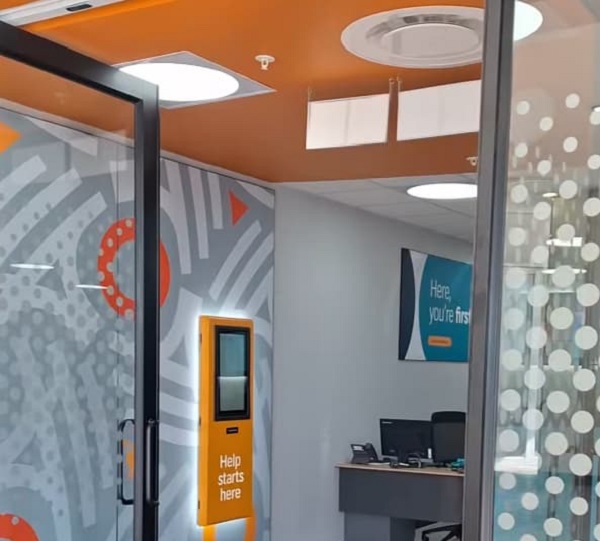 FNB branch office entrance for FNB Fee Schedule: SA Bank Fees